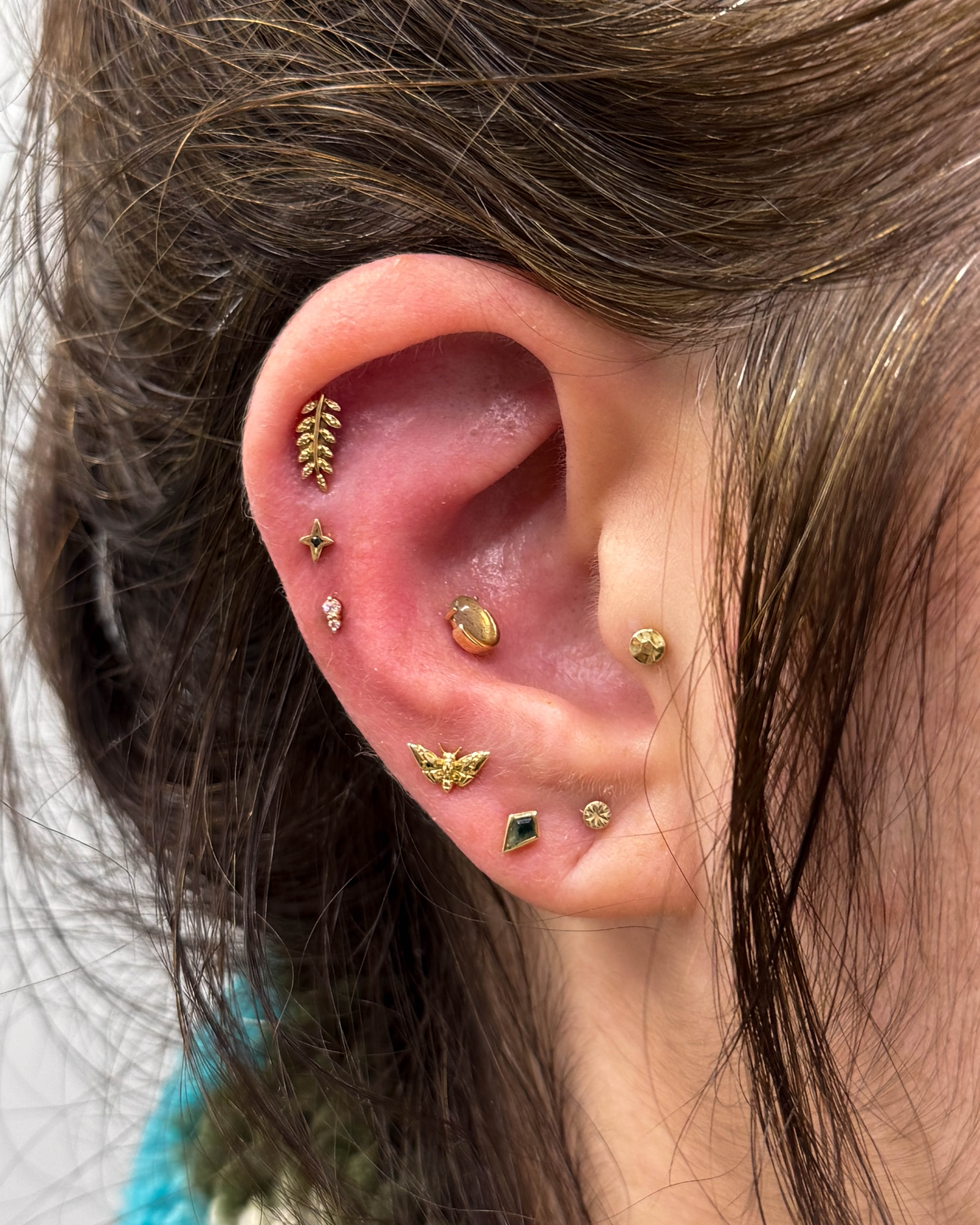 Gold ear curation with Junipurr jewellery pieces