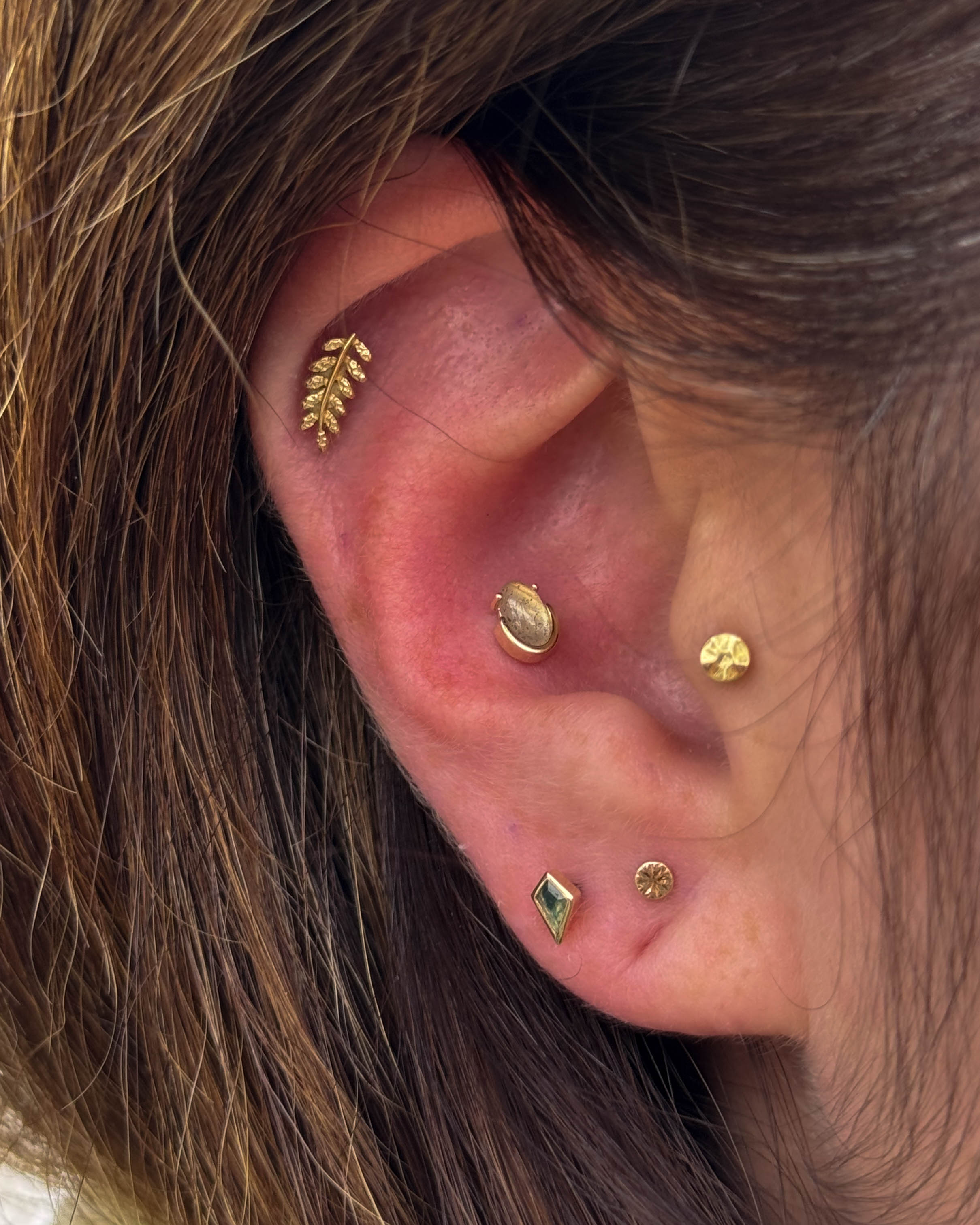 Jen's ear after session two — more pieces added