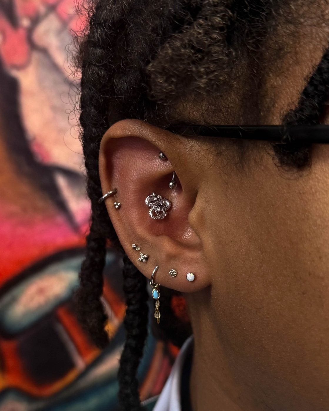 Ear curation featuring First, Second, Third, Fourth and Fifth Lobes, Conch and Double Mid Helix and Rook