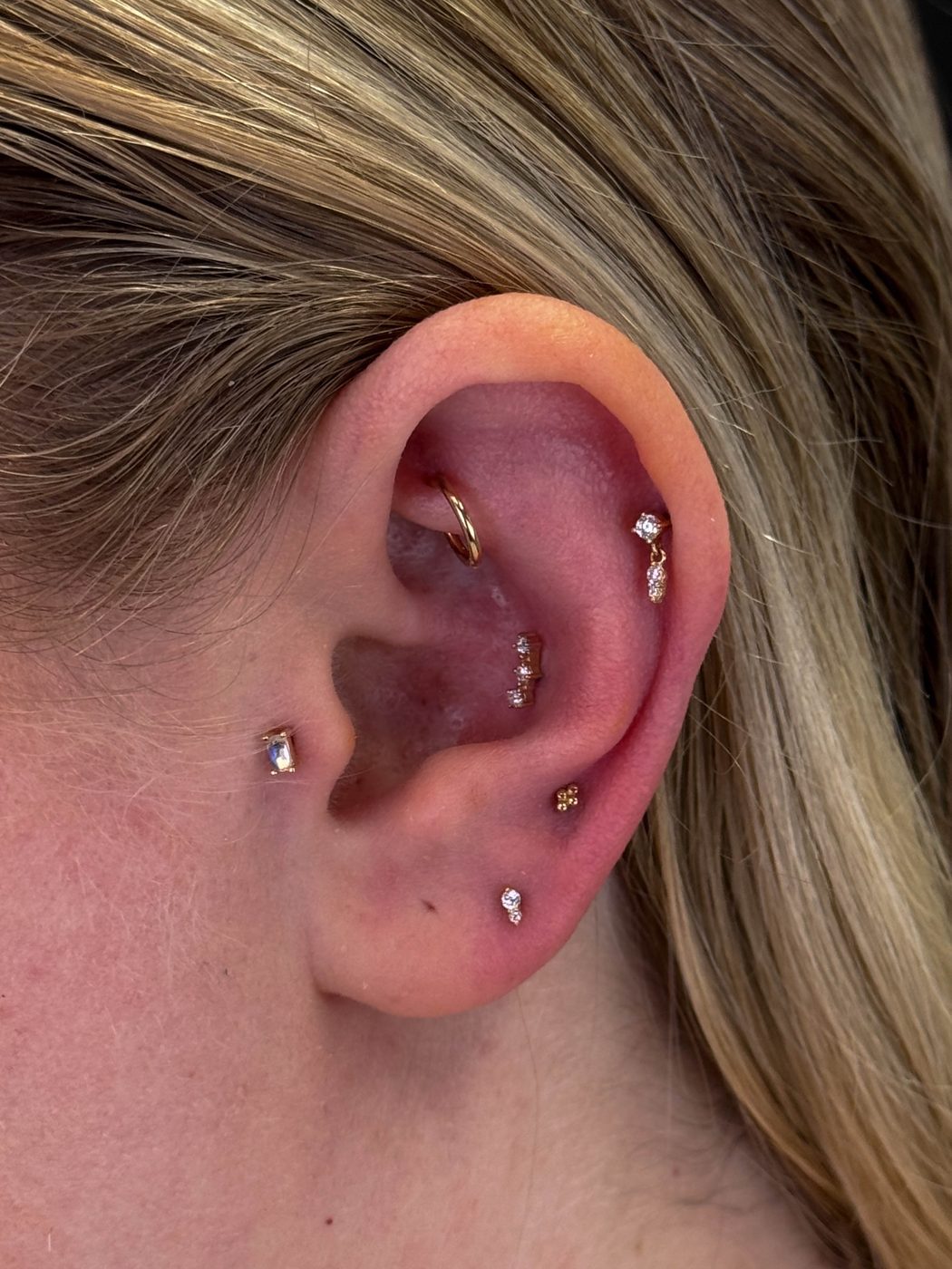 Ear curation featuring Second and Third Lobes, Tragus, Conch Helix and Rook