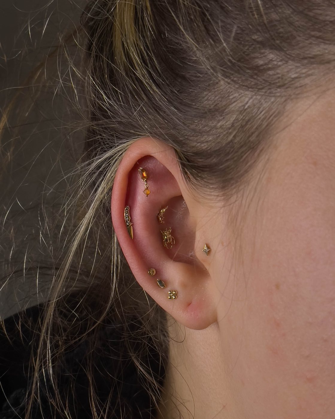 Ear curation featuring Second, Third and Fourth Lobes, Outer Conch, Conch, Tragus, Helix and Flat Helix
