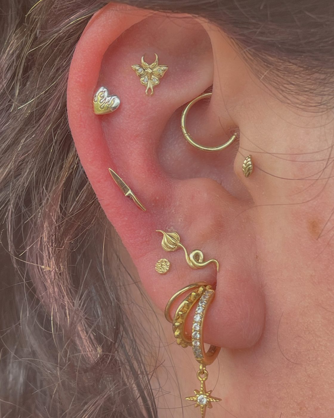 Ear curation featuring Second, Third and Fourth Stacked Lobes, Low Helix, Tragus, Daith, Helix and Flat Helix