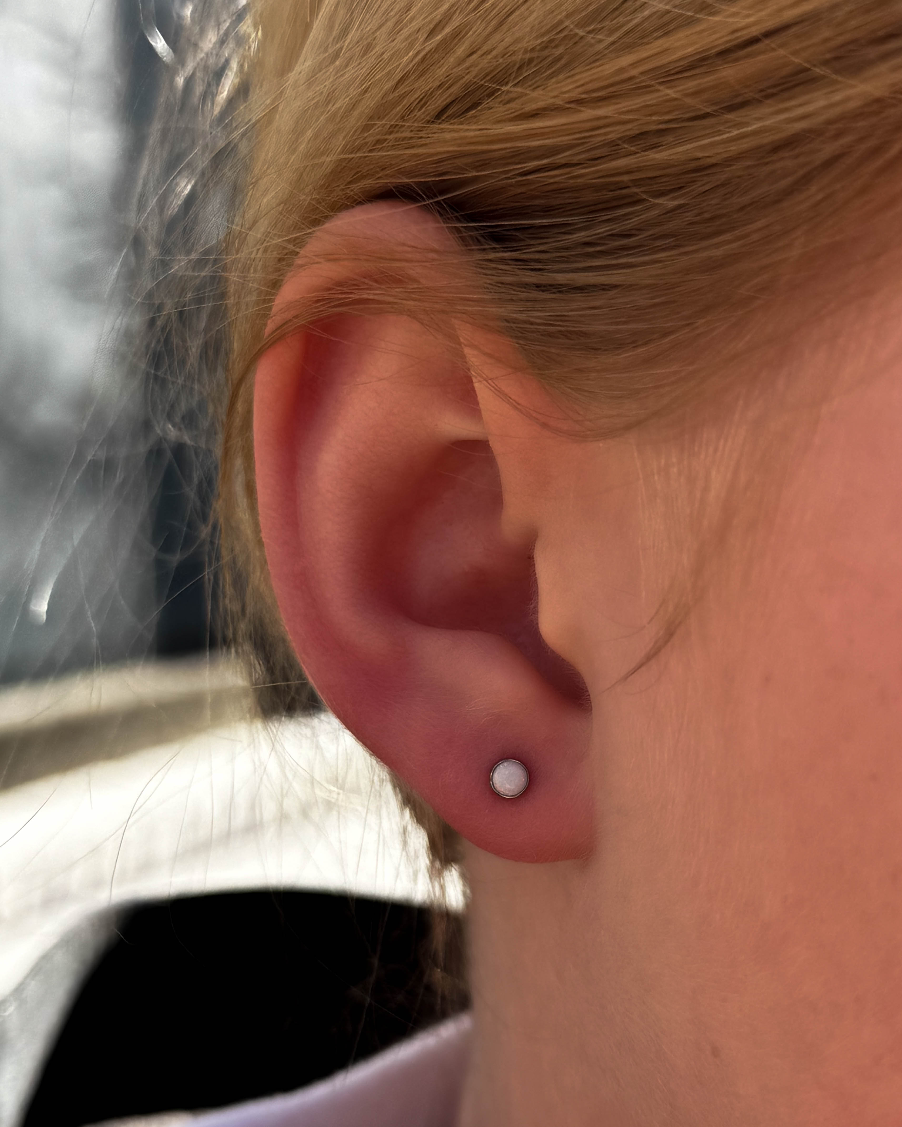 Lobe piercings with gold jewellery by Stab Daddy Bri